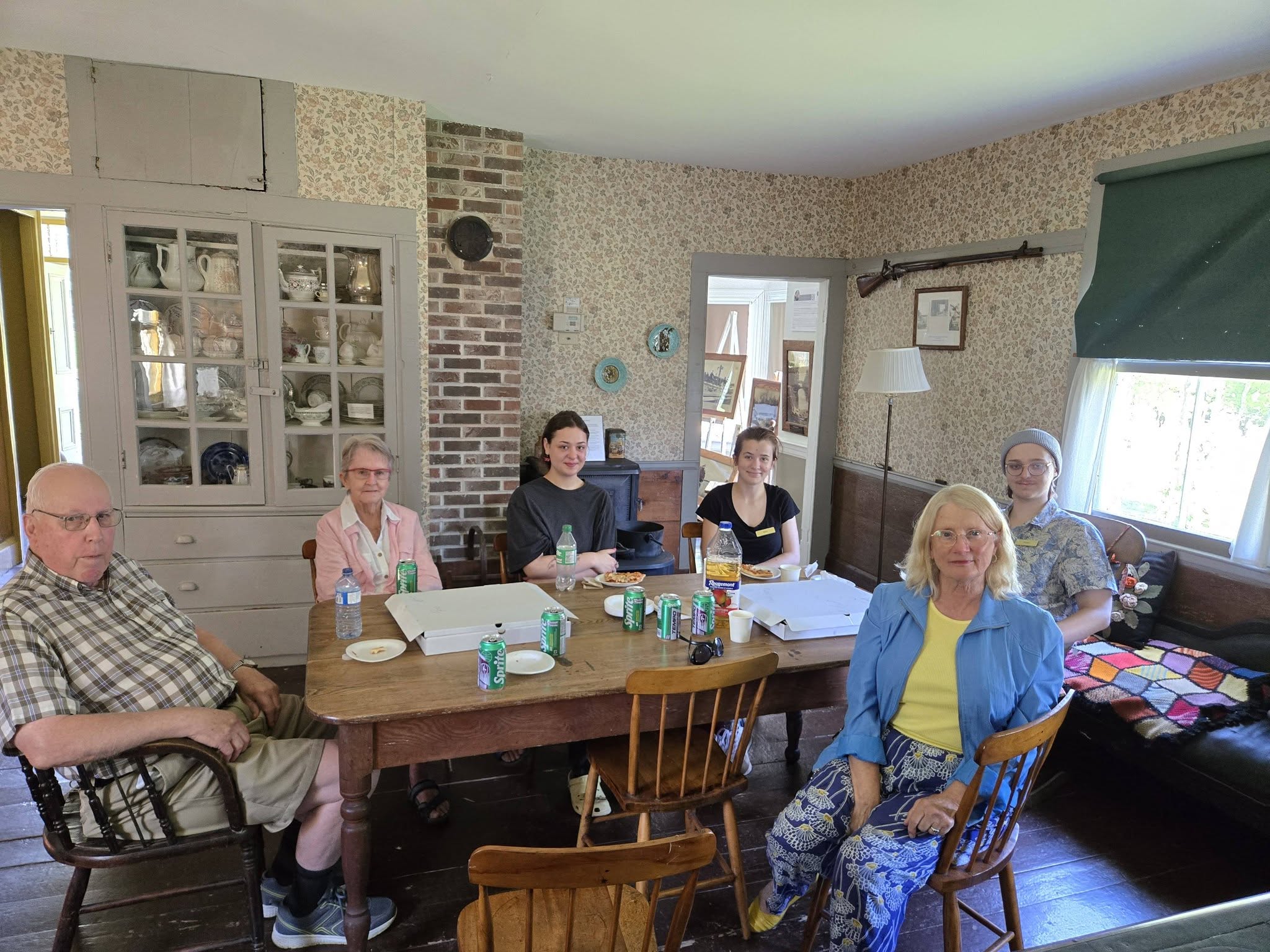 Volunteers and visitors inside North Queens Heritage House